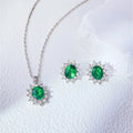 Green Stone Zircon Pendant Set Add a pop of sparkle to your everyday look with this lightweight silver-tone pendant set featuring a dazzling green crystal and matching stud earrings. Perfect for casual to festive wear! Silver pendant set with oval green zircon stone and matching stud earrings for women