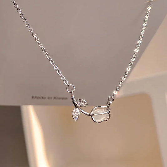 Elegant Tulip Pendant Necklace featuring a silver tulip flower pendant with crystal accents.