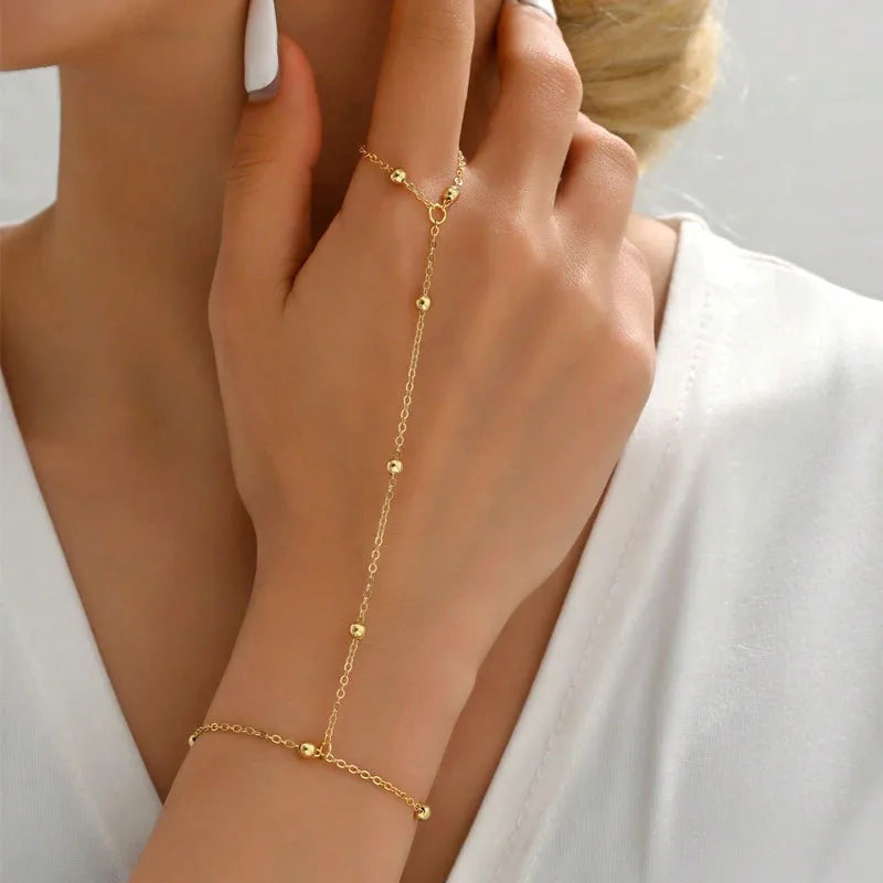 Fashion Sequin Chain Ring Bracelet – Stylish gold hand chain jewelry for women with delicate sequin accents.Add a touch of elegance to your look with this Fashion Sequin Chain Ring Bracelet — a minimal yet statement piece for every outfit.