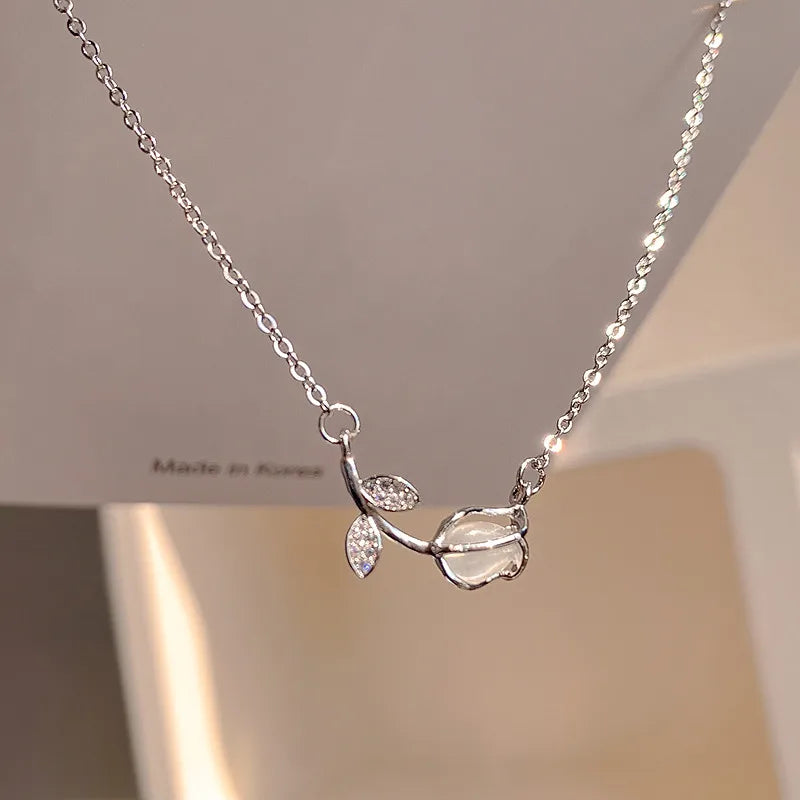 Elegant Tulip Pendant Necklace featuring a silver tulip flower pendant with crystal accents.