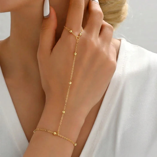Fashion Sequin Chain Ring Bracelet – Stylish gold hand chain jewelry for women with delicate sequin accents.Add a touch of elegance to your look with this Fashion Sequin Chain Ring Bracelet — a minimal yet statement piece for every outfit.