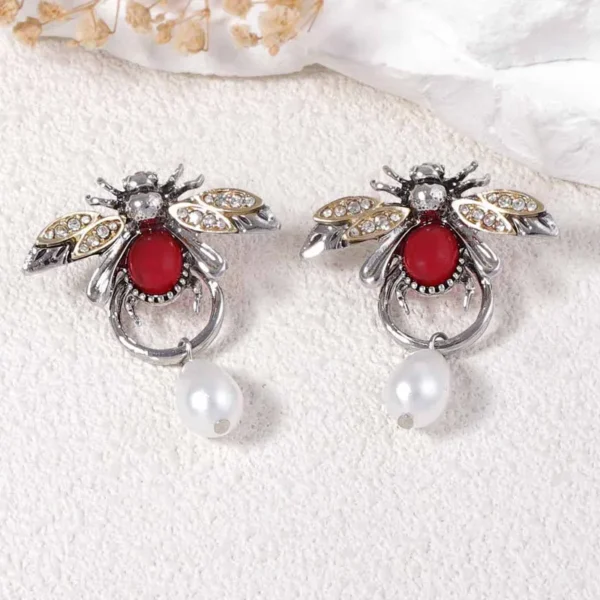 Silver honey bee earrings with red stone body, crystal wings,shiny zircon and pearl drop