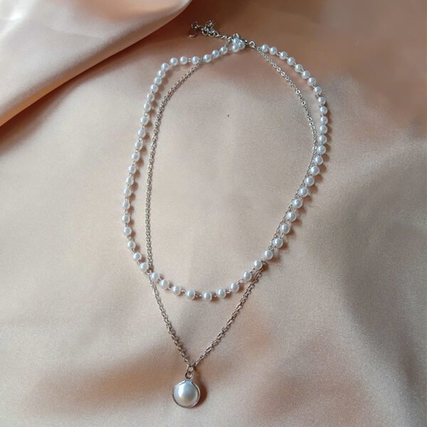 Double layer stylish pearl bracelet – imitation pearls gold plated alloy chain close-up view India